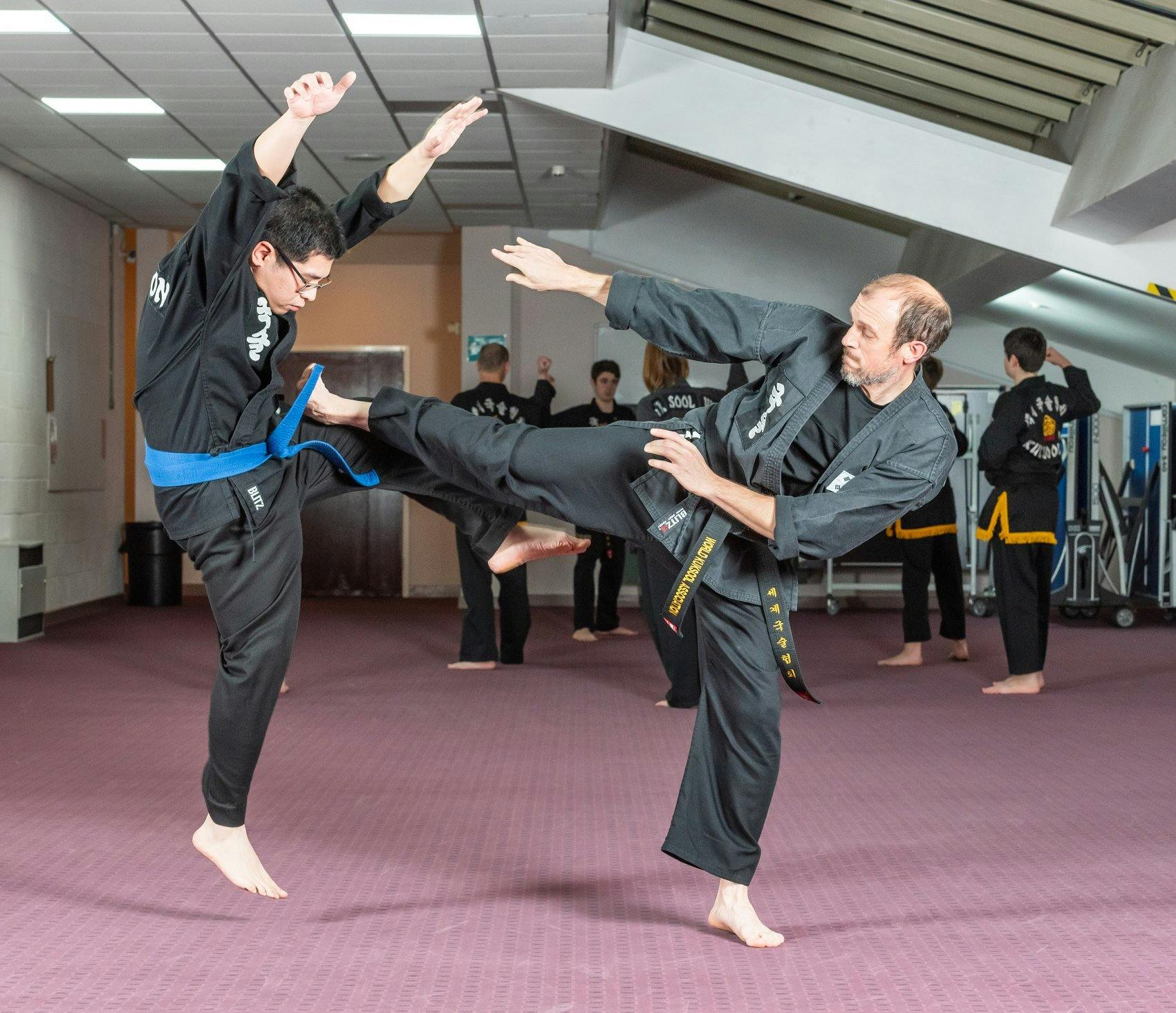 Two men practicing karate